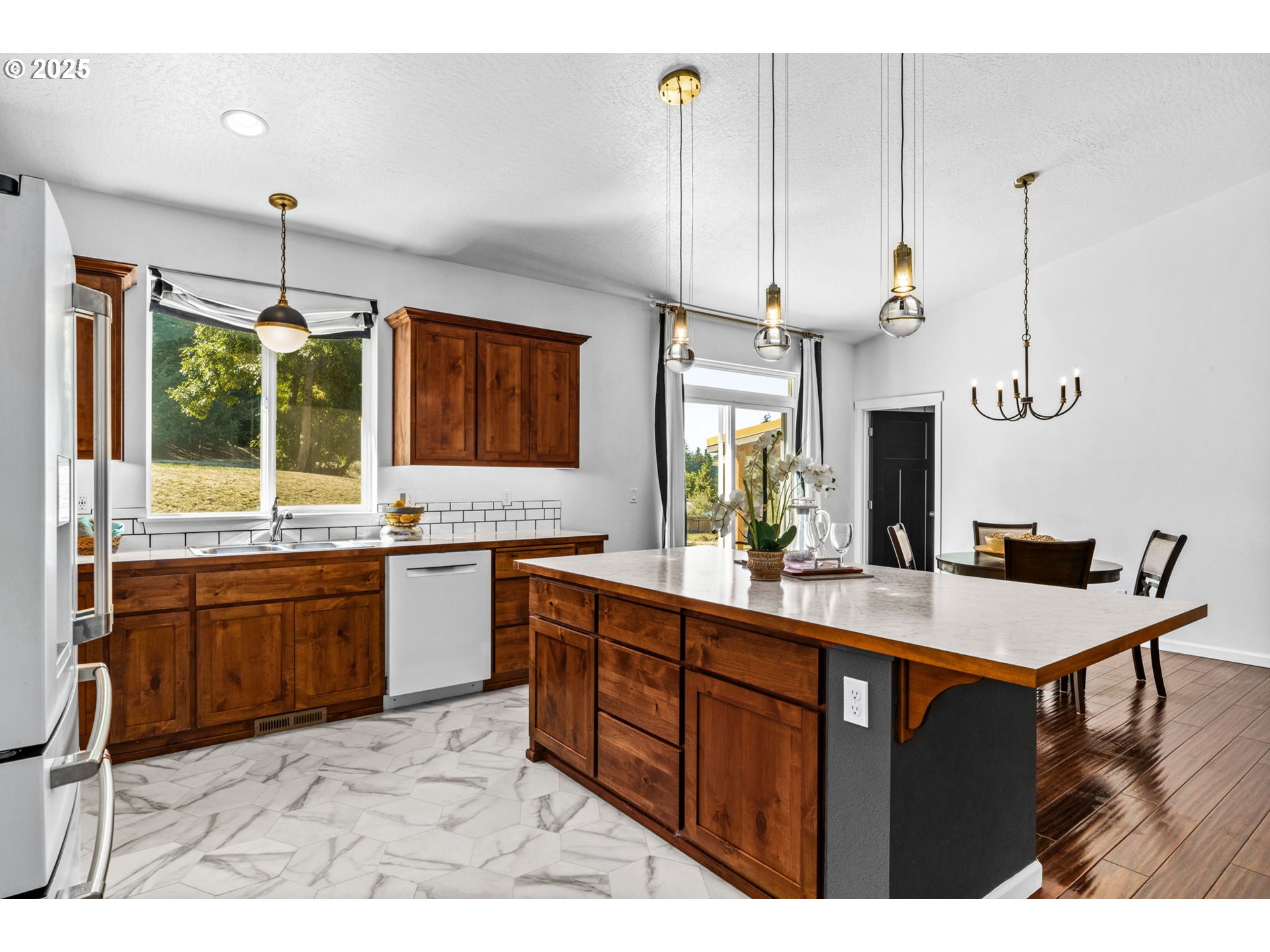 2187 East Madison Avenue Cottage Grove, OR 97424 - Photo 12 of 41 a kitchen with stainless steel appliances granite countertop a sink a stove and a wooden floors