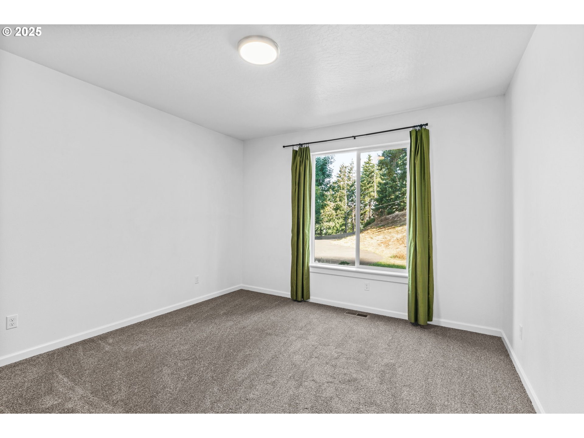2187 East Madison Avenue Cottage Grove, OR 97424 - Photo 21 of 41 a view of an empty room with a window