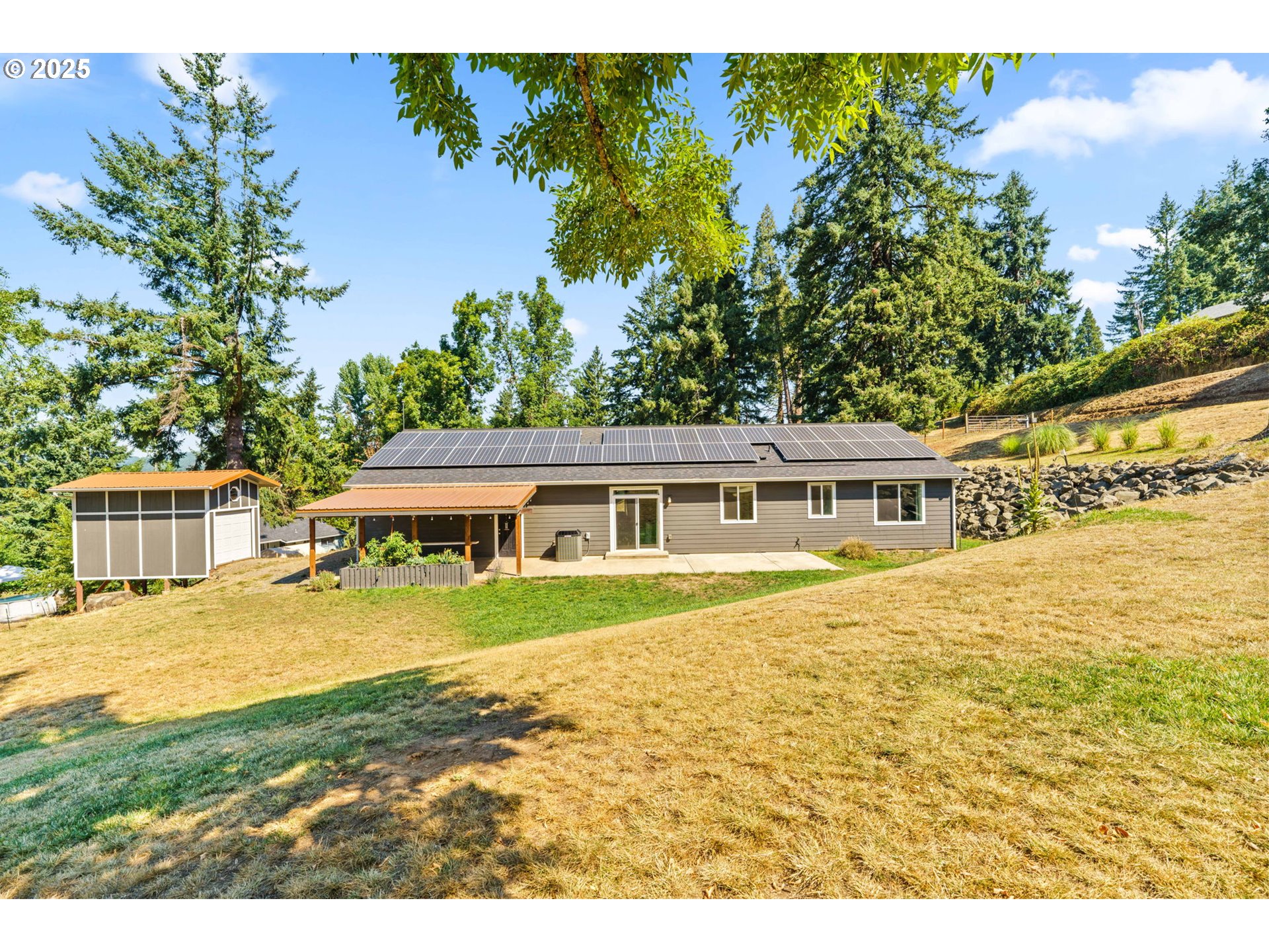 2187 East Madison Avenue Cottage Grove, OR 97424 - Photo 22 of 41 a front view of a house with a yard