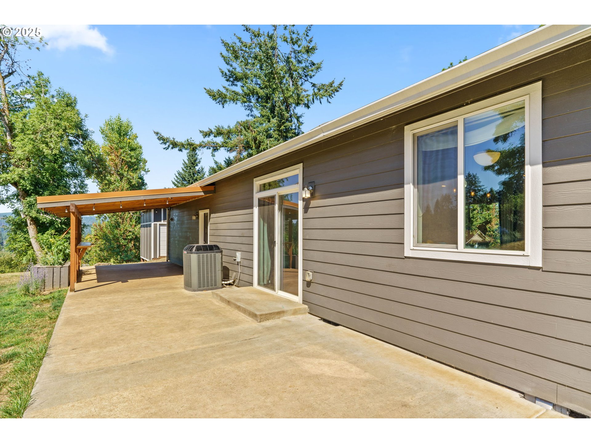 2187 East Madison Avenue Cottage Grove, OR 97424 - Photo 23 of 41 a view of a house with a patio