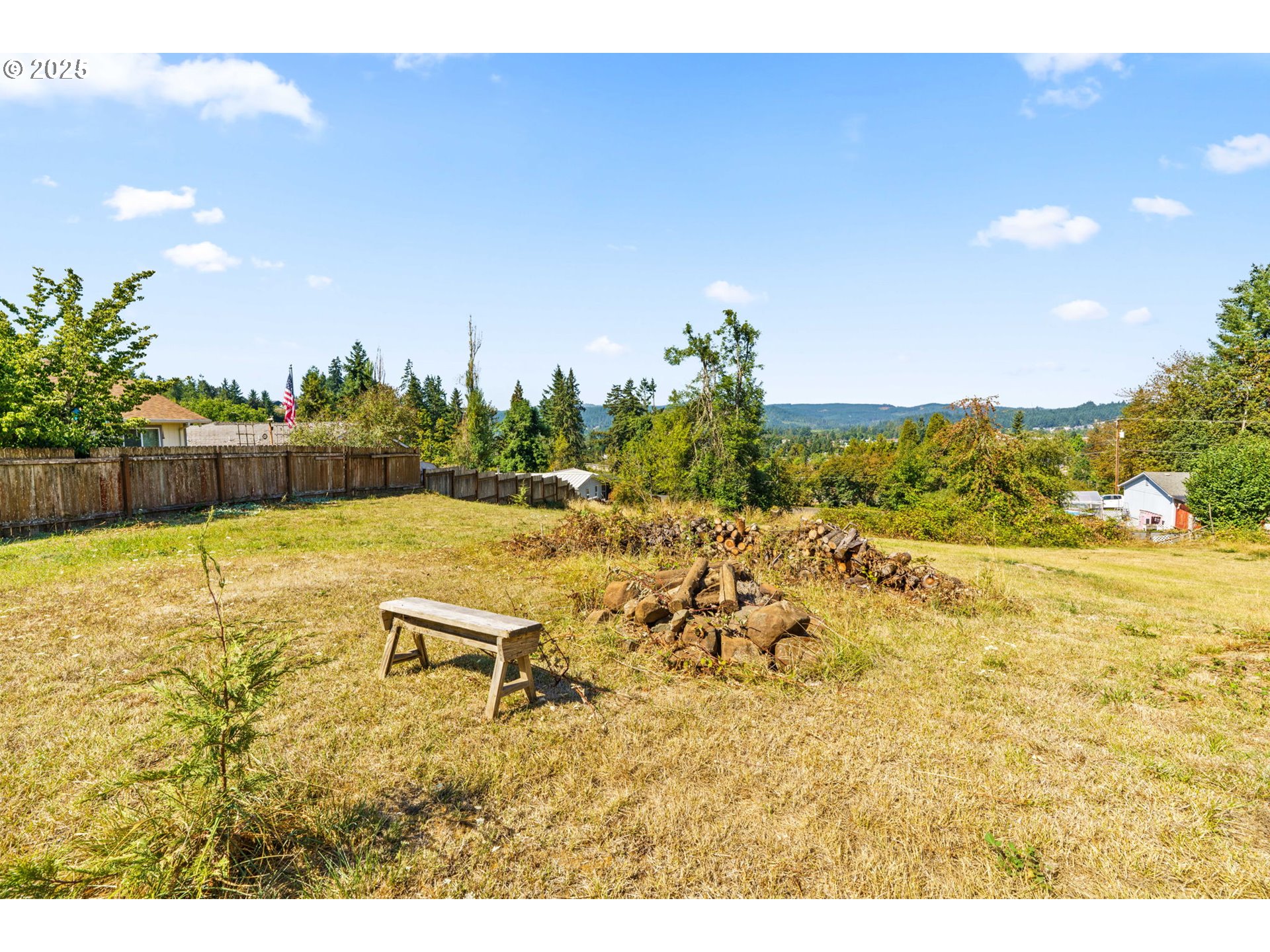 2187 East Madison Avenue Cottage Grove, OR 97424 - Photo 29 of 41 a view of a swimming pool with an outdoor seating and a garden