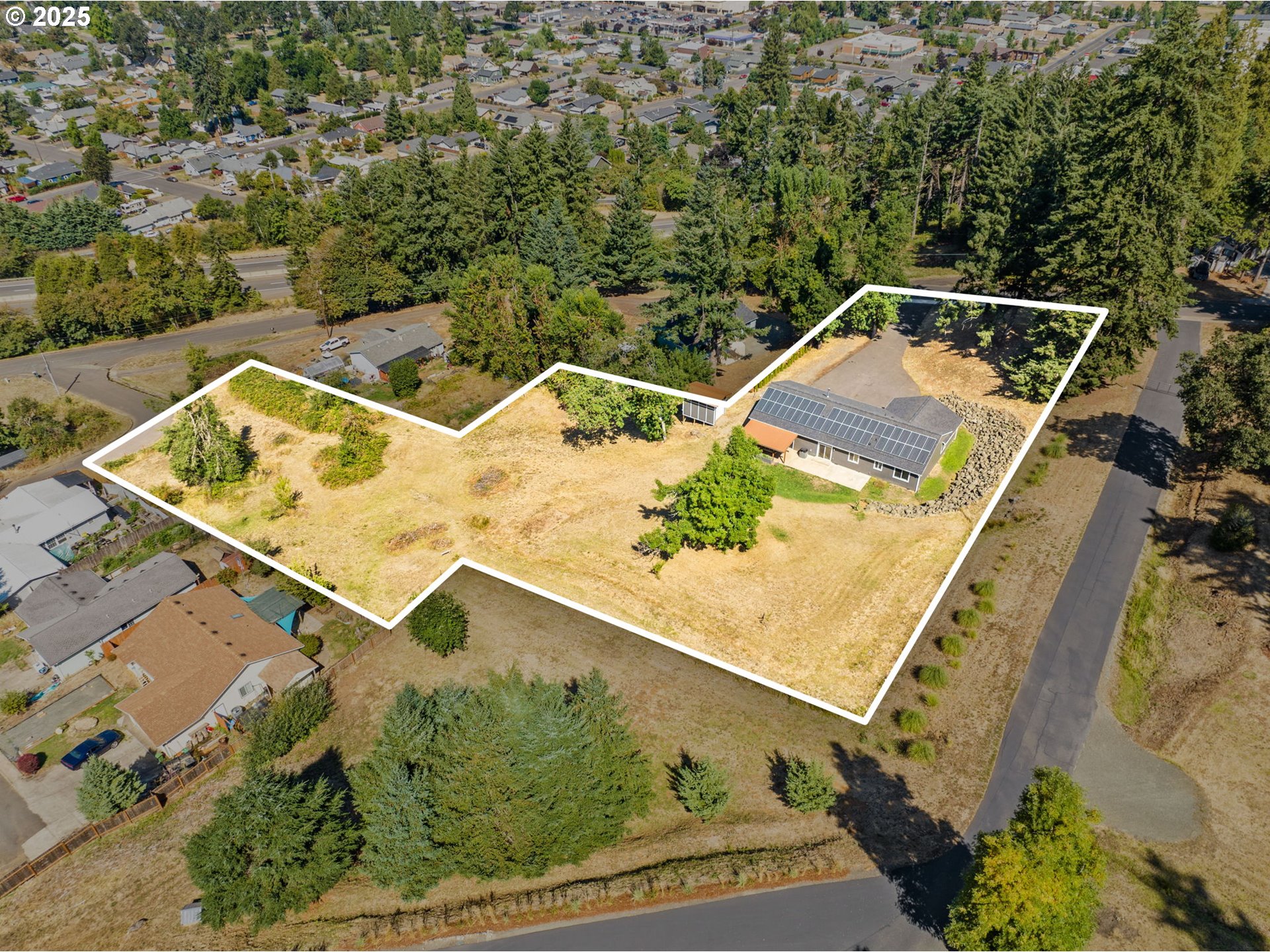 2187 East Madison Avenue Cottage Grove, OR 97424 - Photo 35 of 41 an aerial view of a house with a yard