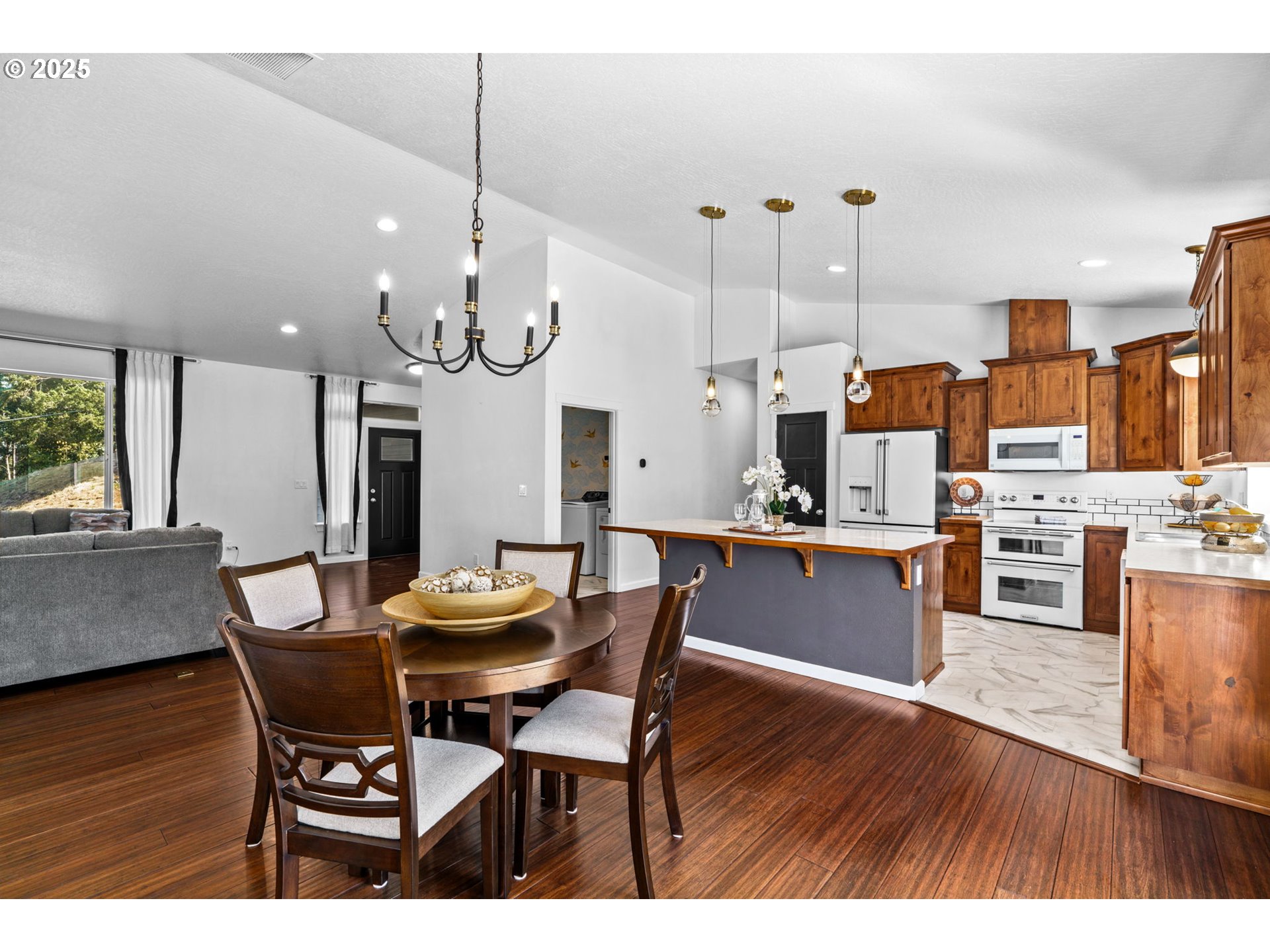 2187 East Madison Avenue Cottage Grove, OR 97424 - Photo 4 of 41 a view of a dining room with furniture and wooden floor