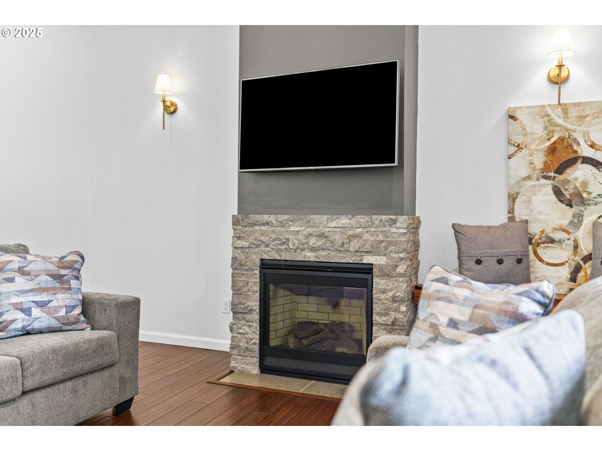 2187 East Madison Avenue Cottage Grove, OR 97424 - Photo 6 of 41 a living room with furniture a flat screen tv and a fireplace