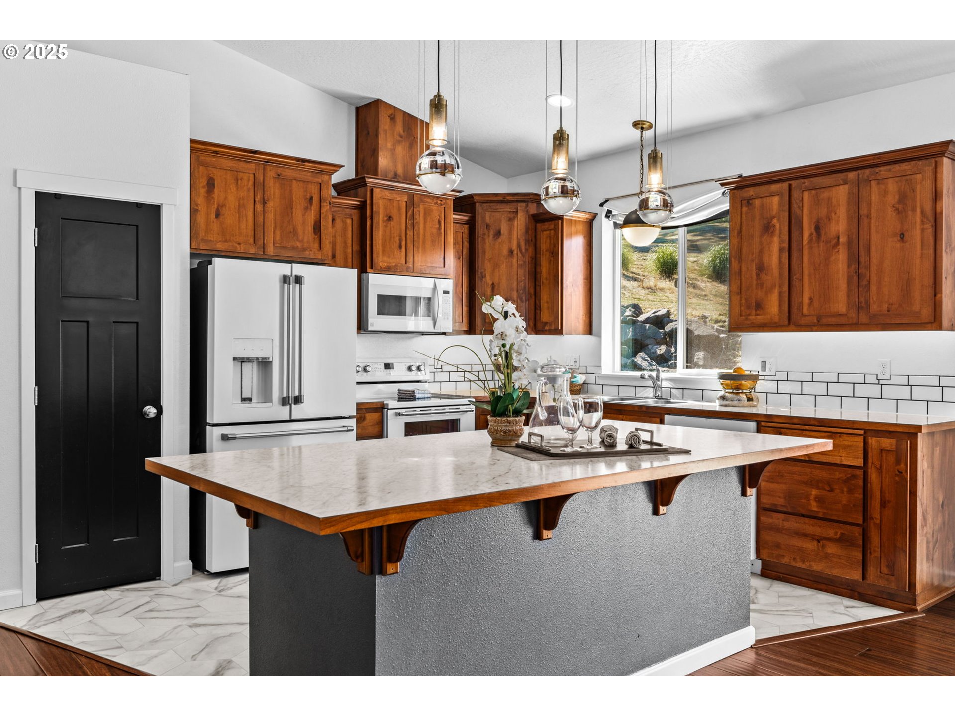 2187 East Madison Avenue Cottage Grove, OR 97424 - Photo 9 of 41 a kitchen with stainless steel appliances granite countertop a sink stove and refrigerator