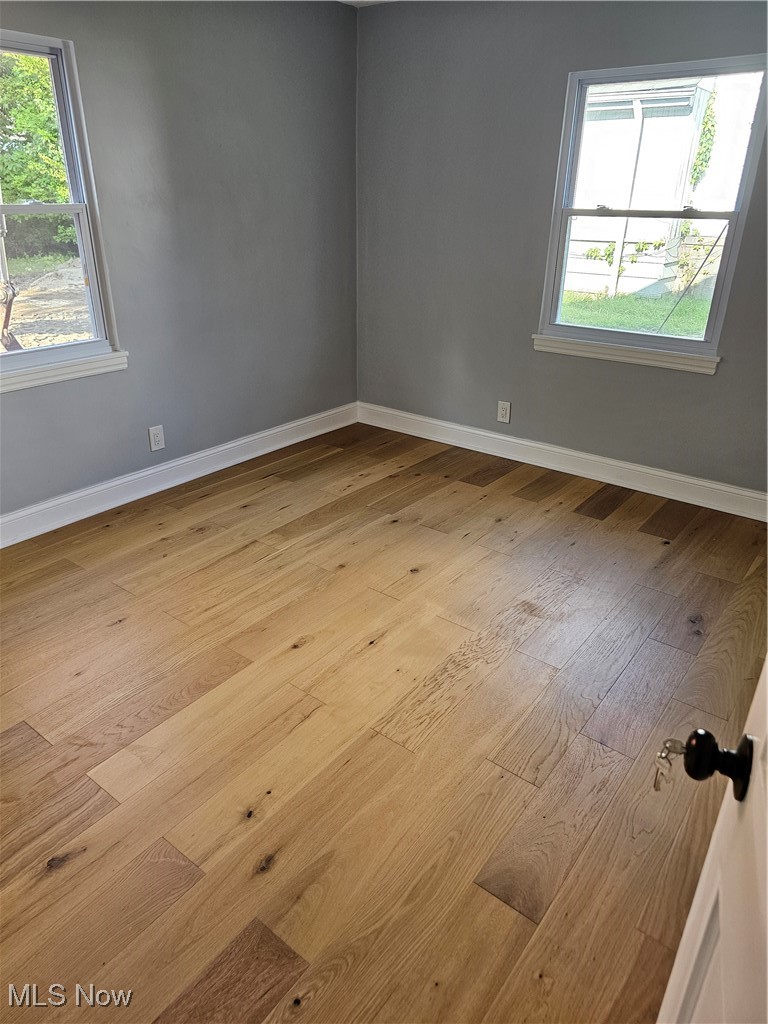 3999 Lancaster Road South Euclid, OH 44121 - Photo 5 of 17 Unfurnished room featuring light hardwood / wood-style floors and a healthy amount of sunlight