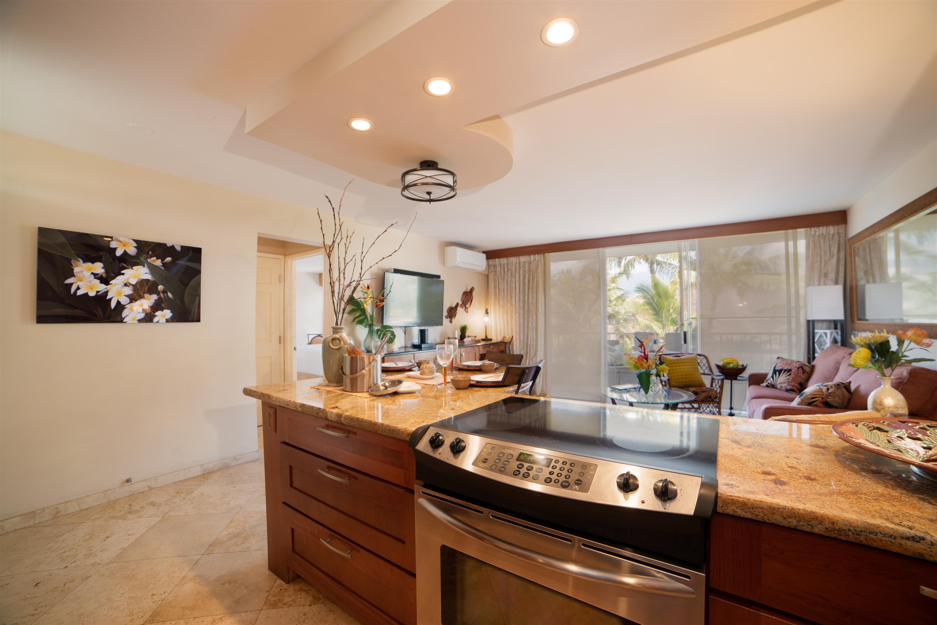 73 North Kihei Road, Unit 308 Kihei, HI 96753 - Photo 11 of 23 a kitchen with stainless steel appliances a sink and a large window