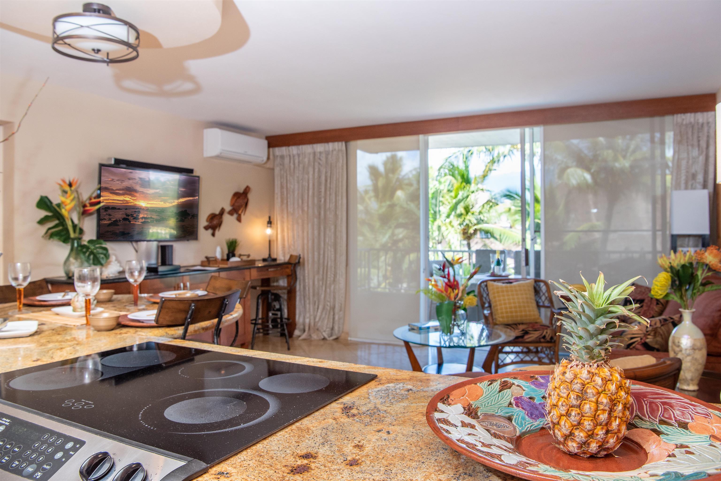 73 North Kihei Road, Unit 308 Kihei, HI 96753 - Photo 12 of 23 a living room with furniture and a fireplace