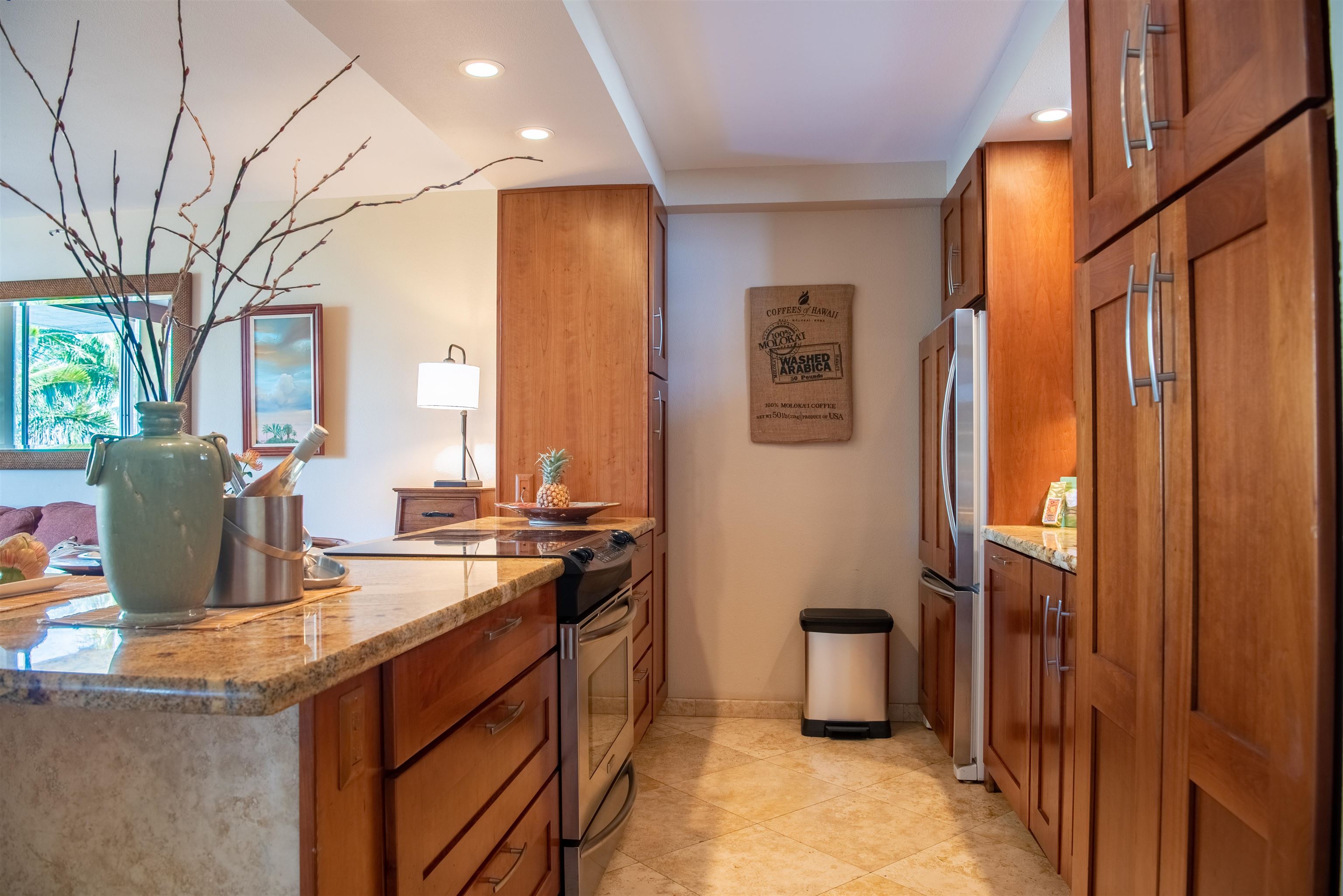 73 North Kihei Road, Unit 308 Kihei, HI 96753 - Photo 16 of 23 a kitchen with a stove and a refrigerator
