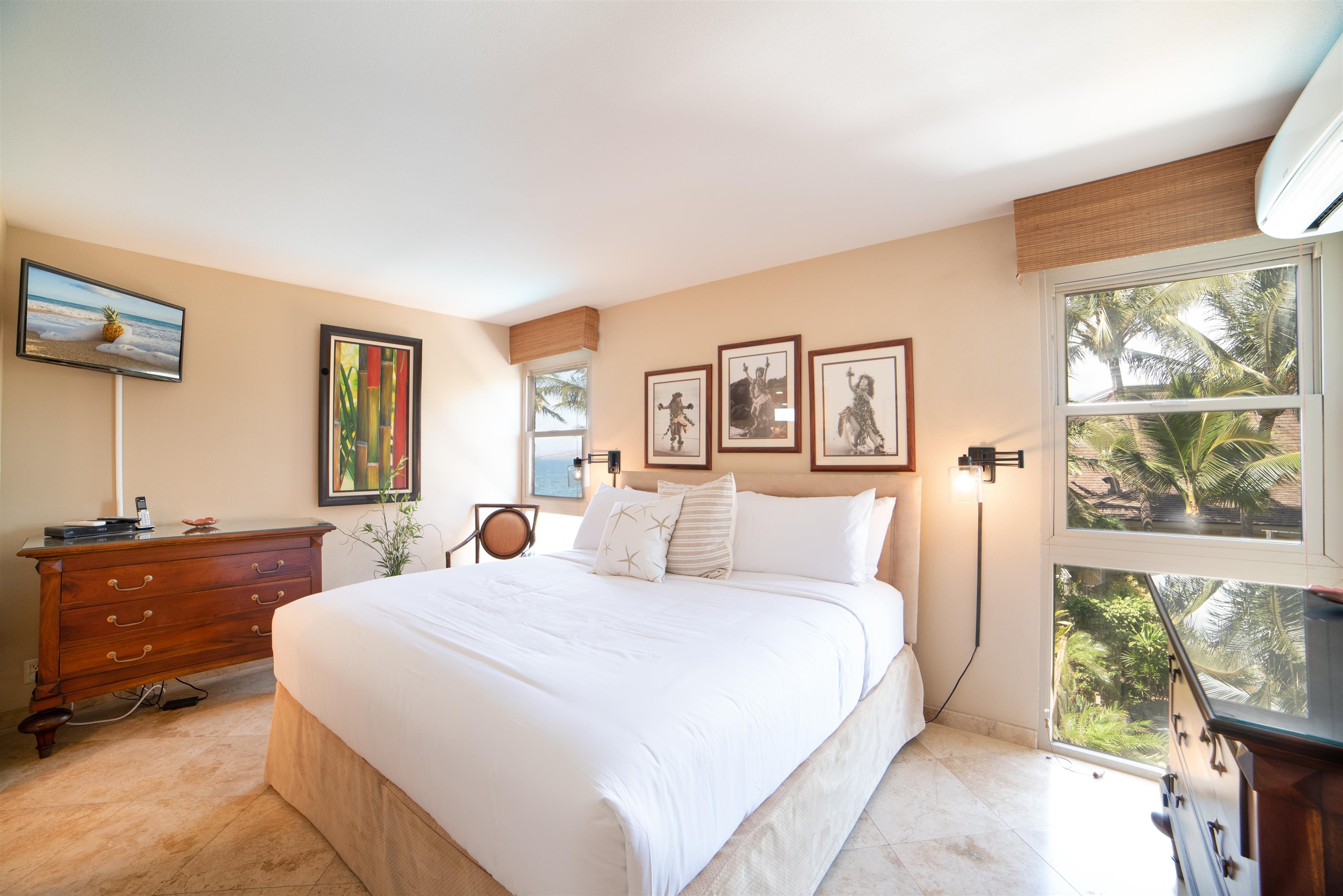 73 North Kihei Road, Unit 308 Kihei, HI 96753 - Photo 18 of 23 a bedroom with a large bed and a dresser