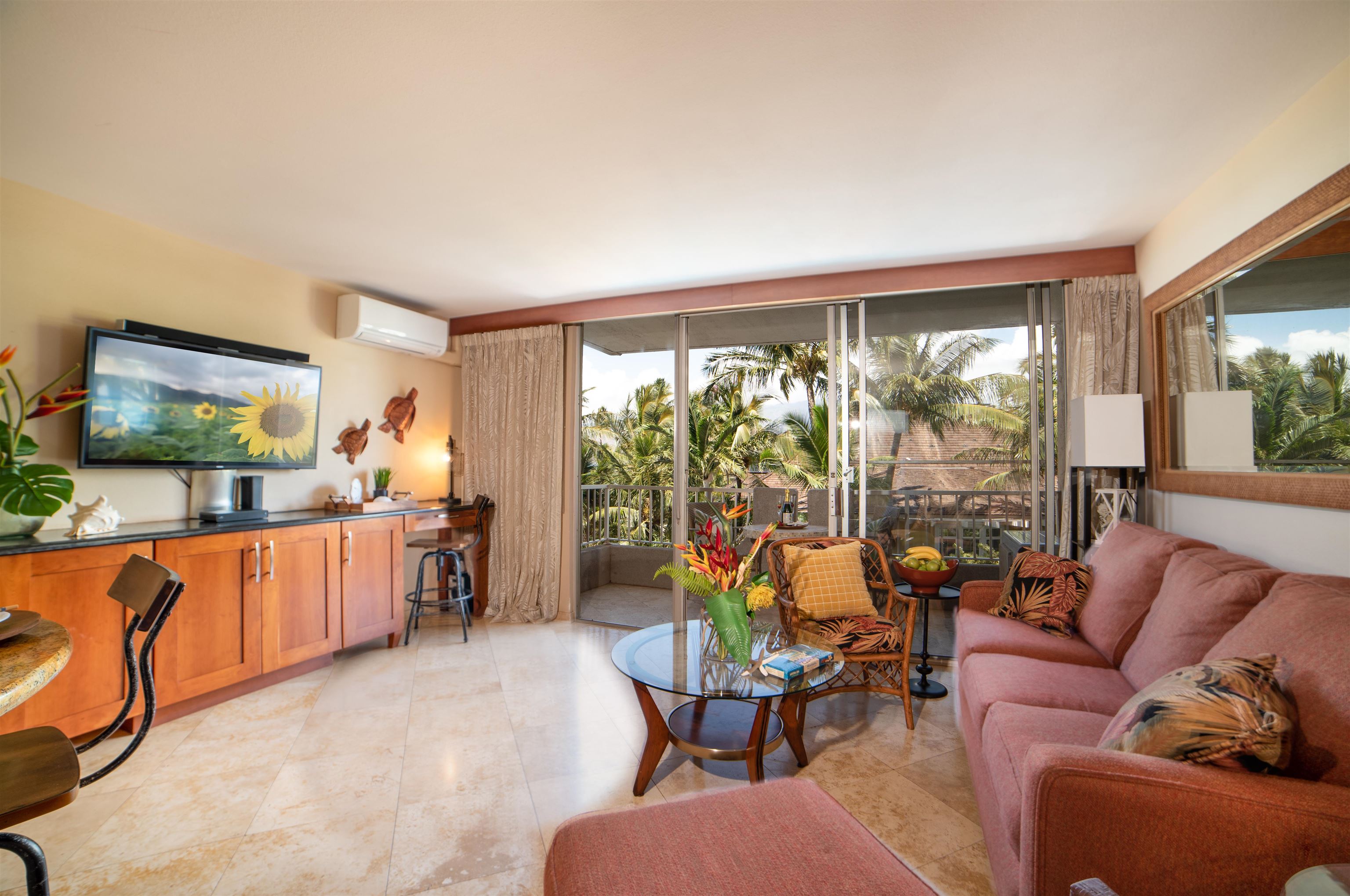 73 North Kihei Road, Unit 308 Kihei, HI 96753 - Photo 2 of 23 a living room with furniture and a flat screen tv