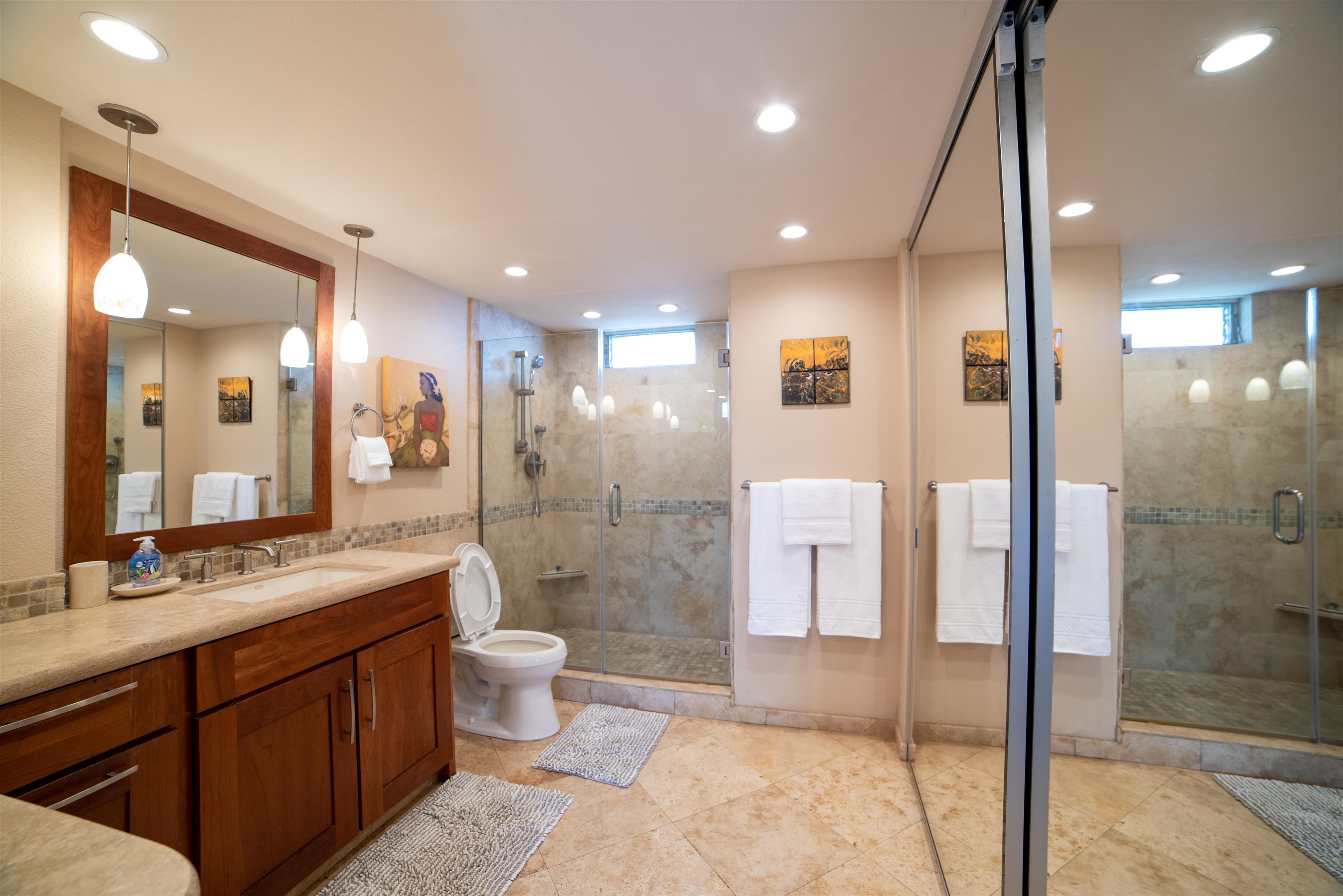 73 North Kihei Road, Unit 308 Kihei, HI 96753 - Photo 21 of 23 a bathroom with a double vanity sink toilet and shower