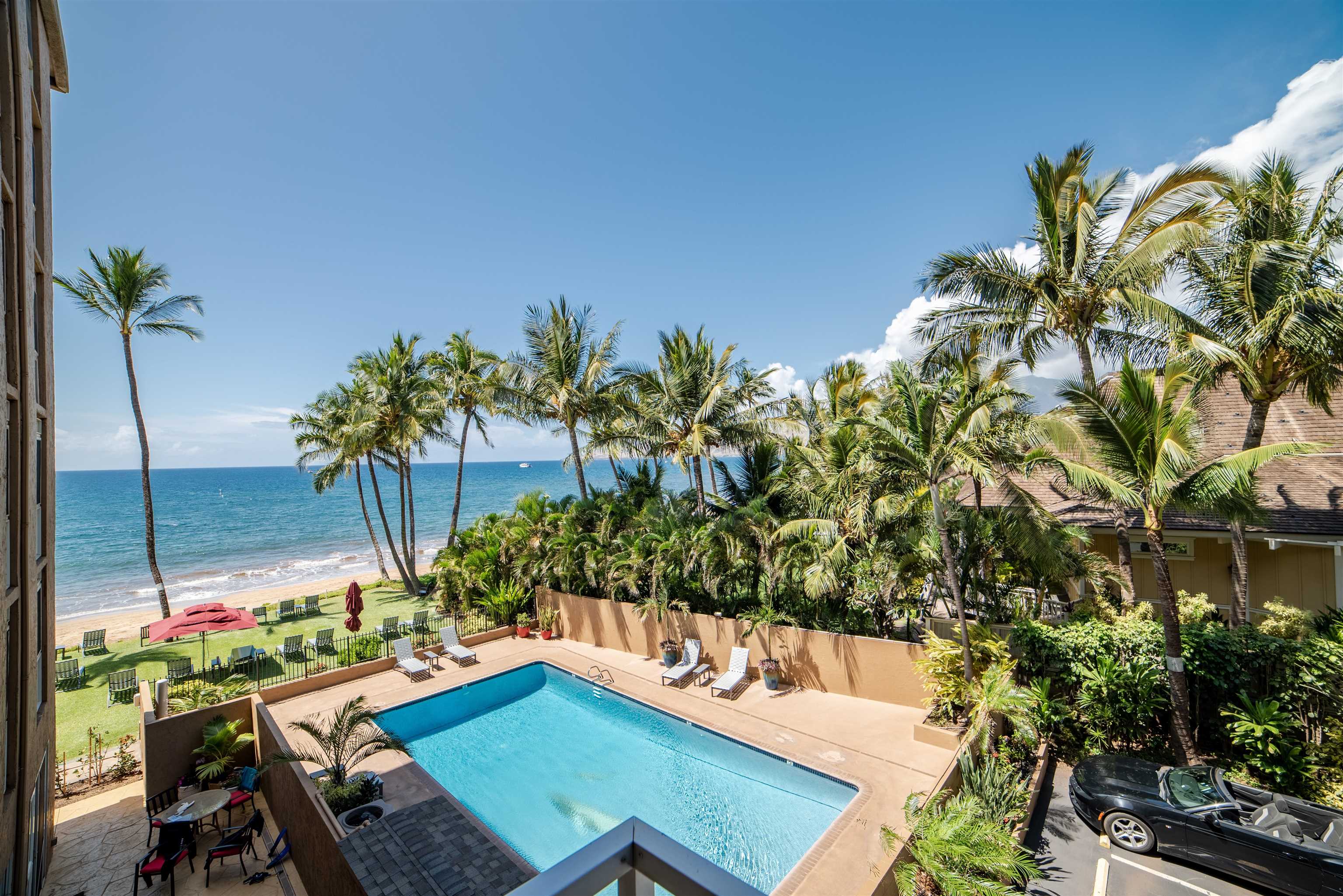 73 North Kihei Road, Unit 308 Kihei, HI 96753 - Photo 23 of 23 a view of a chairs and table in a backyard