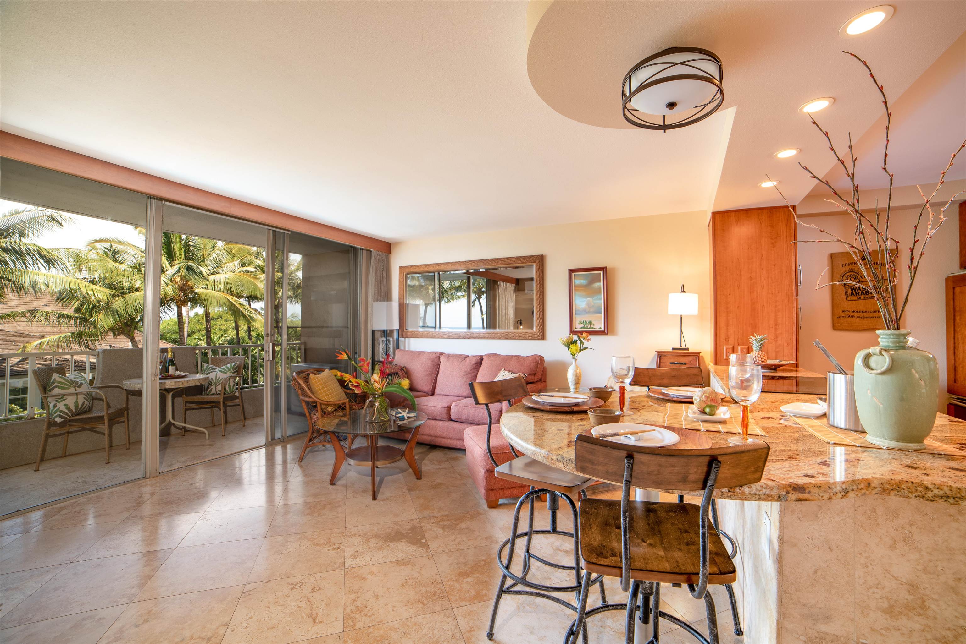 73 North Kihei Road, Unit 308 Kihei, HI 96753 - Photo 6 of 23 a view of a dining room with furniture and chandelier