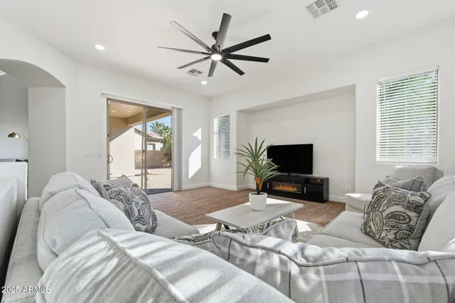 a kitchen with kitchen island granite countertop a sink cabinets stainless steel appliances and a center island