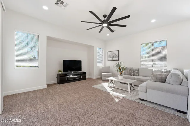a bedroom with two bed and a flat screen tv