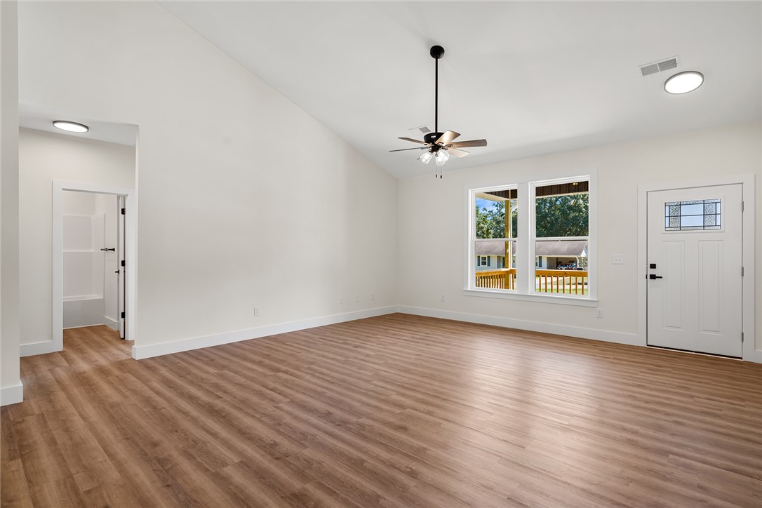 1507 Tindall Avenue Anderson, SC 29621 - Photo 7 of 38 A spacious main room features durable wood-look flooring and a high vaulted ceiling.