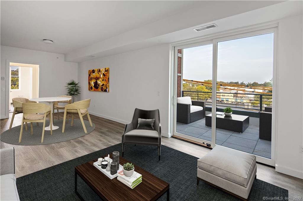 Virtually staged Unit 401 Great room with SGD to private terrace