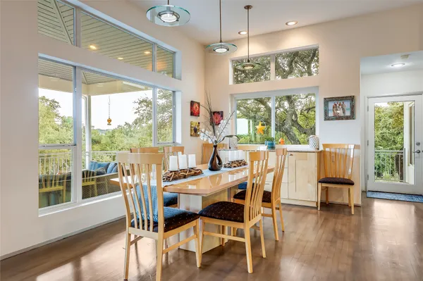 a kitchen with stainless steel appliances granite countertop a sink a stove and a microwave