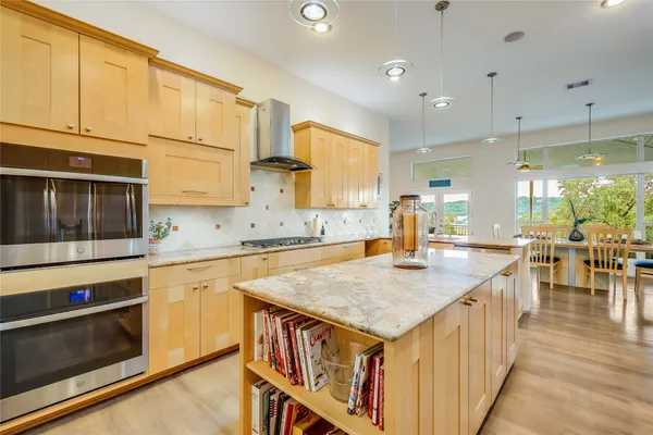a bed room with a bed and a chandelier