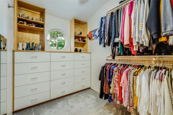 a bedroom with a bed and table