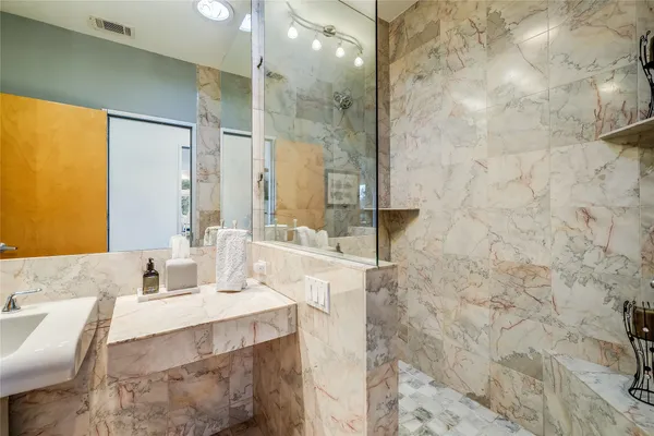 a living room with furniture a ceiling fan and a window