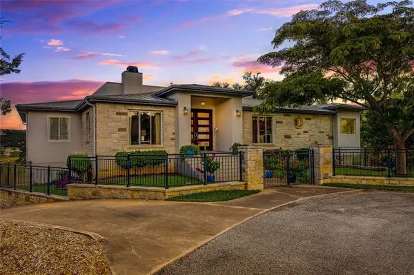 a view of a house with a street