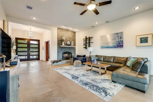 a living room with furniture and a fireplace