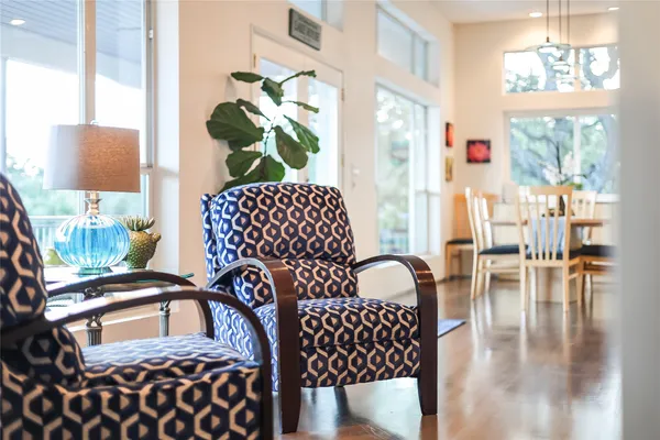 a view of a livingroom with furniture window and wooden floor