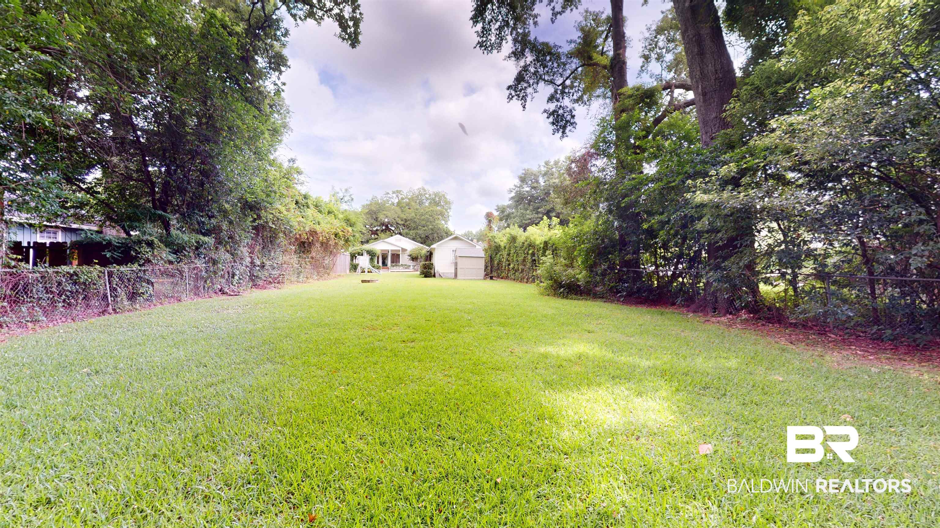 4307 Stein Street Mobile, AL 36608 - Photo 27 of 28 View of yard featuring a storage unit