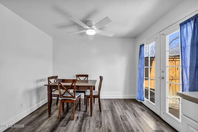 a view of a dining room with furniture window and wooden floor