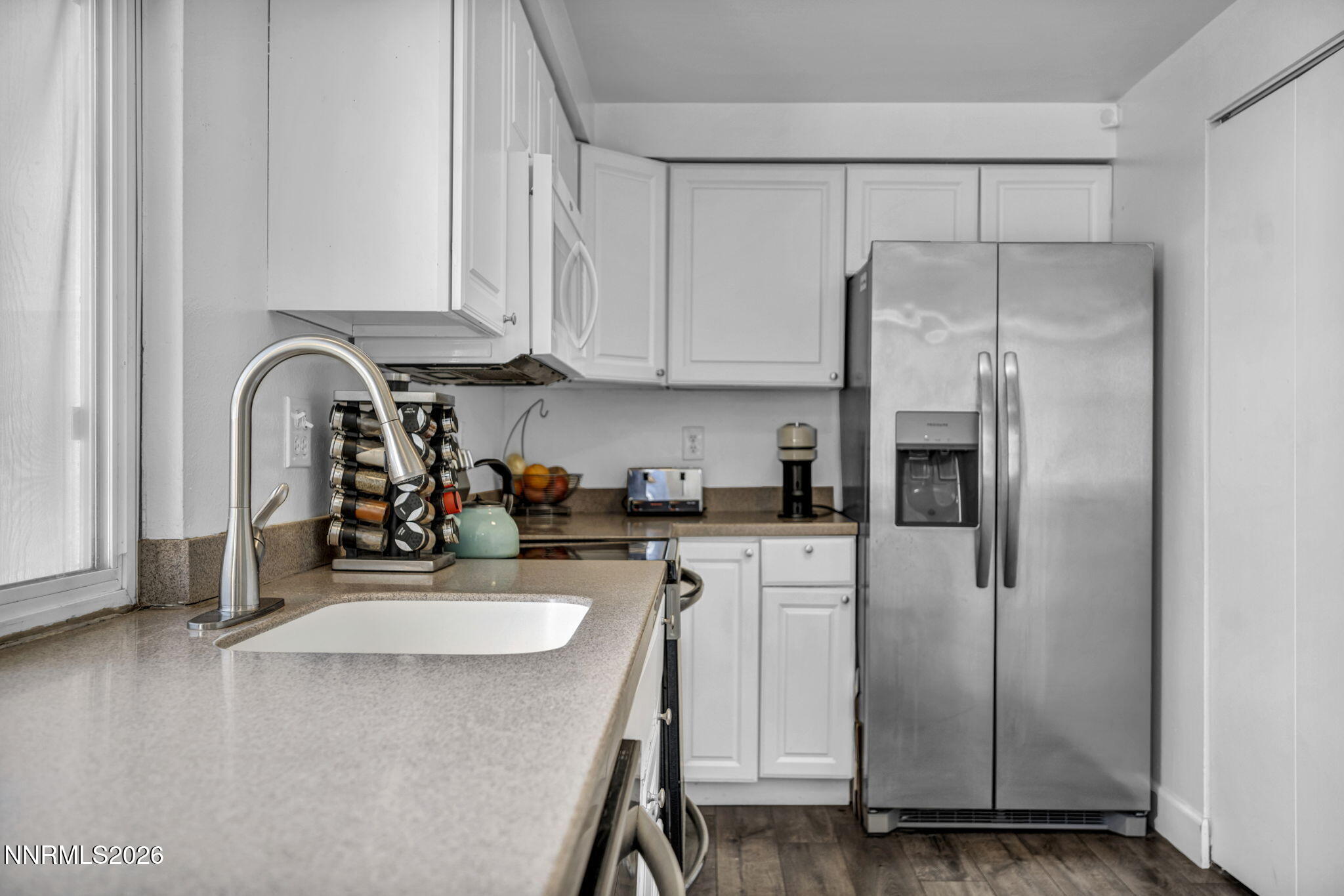 959 Mesa Ridge Drive, Unit 2 Sparks, NV 89434 - Photo 15 of 41 a kitchen with stainless steel appliances a refrigerator sink and cabinets