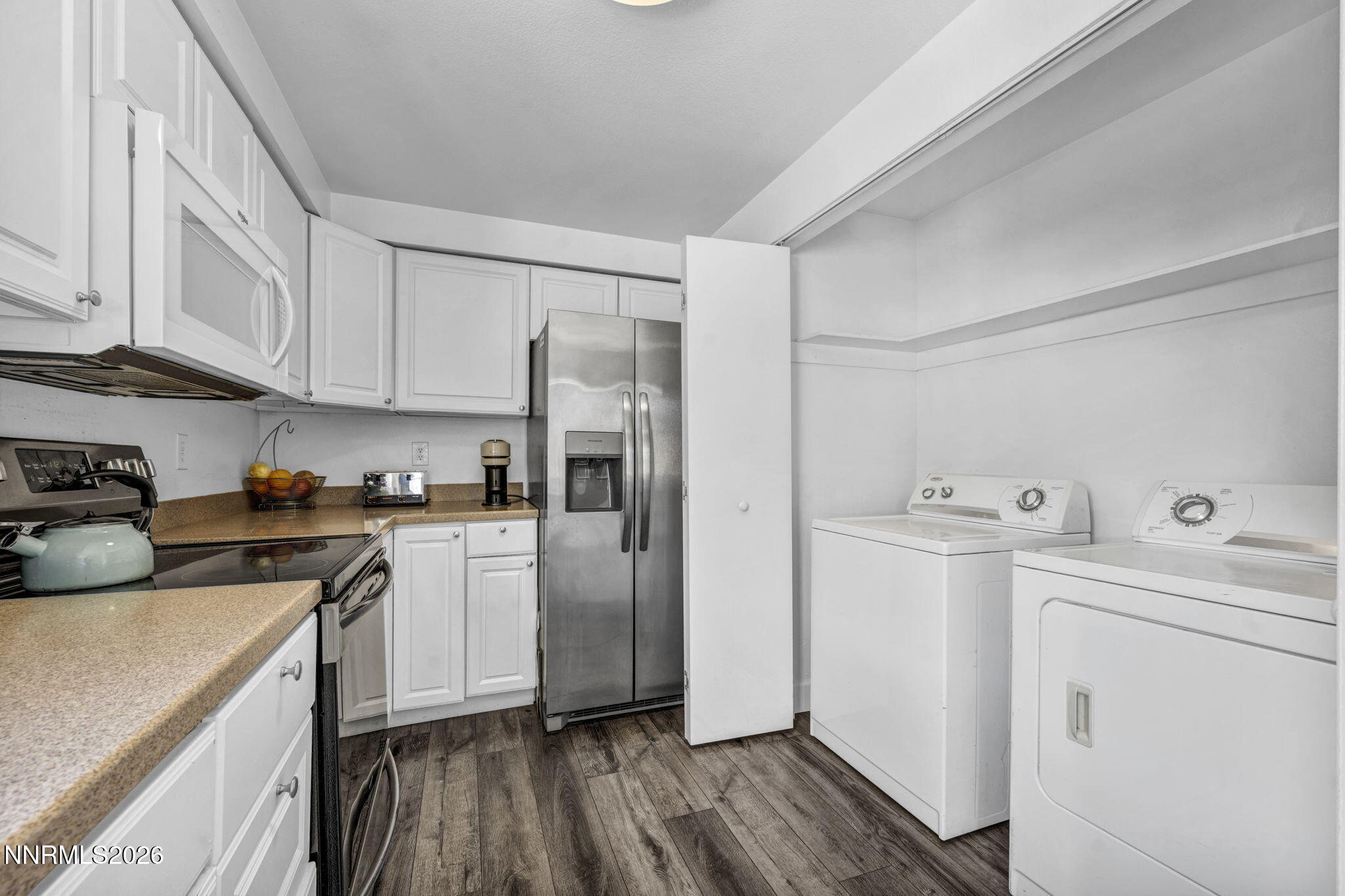 959 Mesa Ridge Drive, Unit 2 Sparks, NV 89434 - Photo 16 of 41 a kitchen with a white cabinets and wooden floor