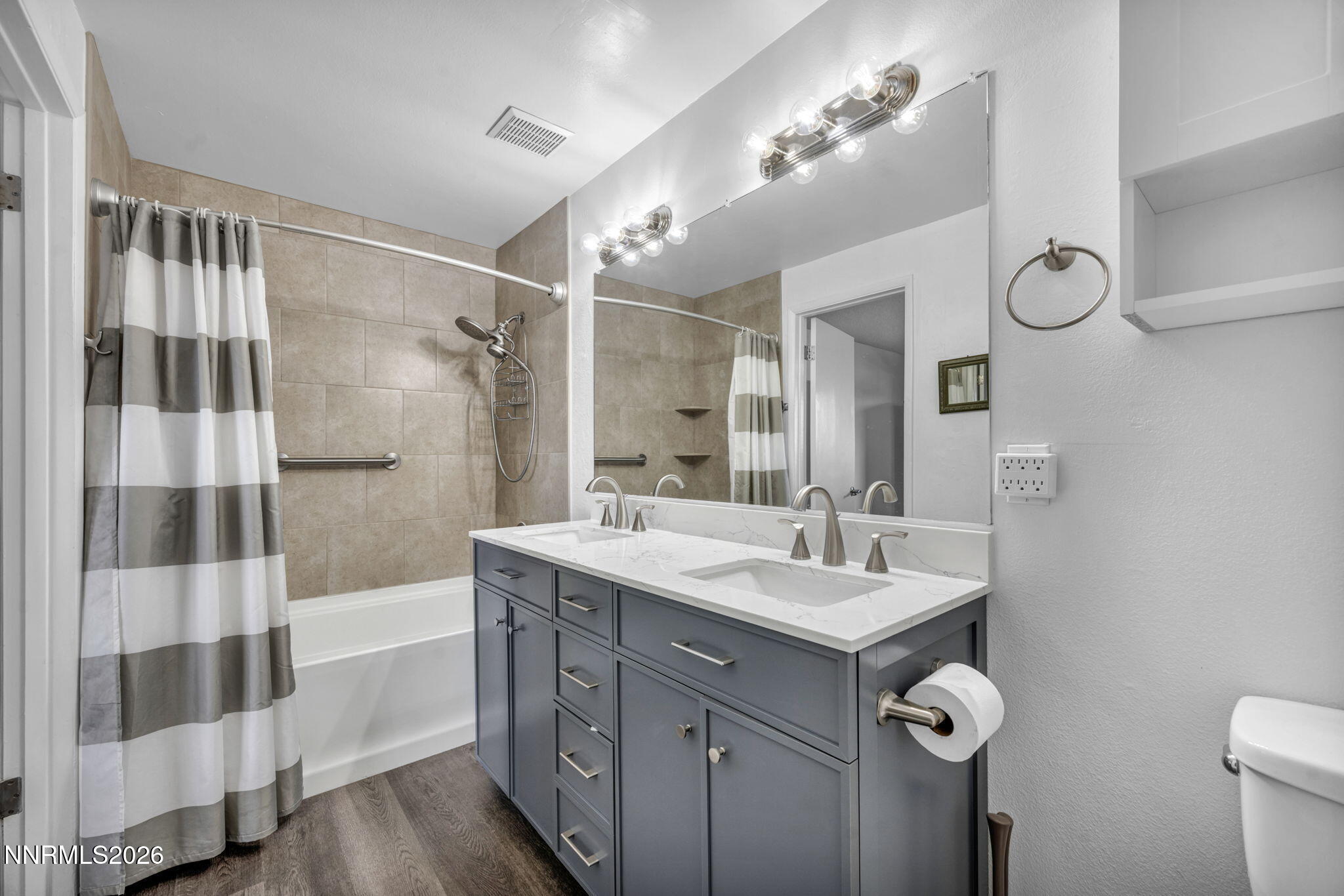 959 Mesa Ridge Drive, Unit 2 Sparks, NV 89434 - Photo 19 of 41 a bathroom with a sink and mirror with shower