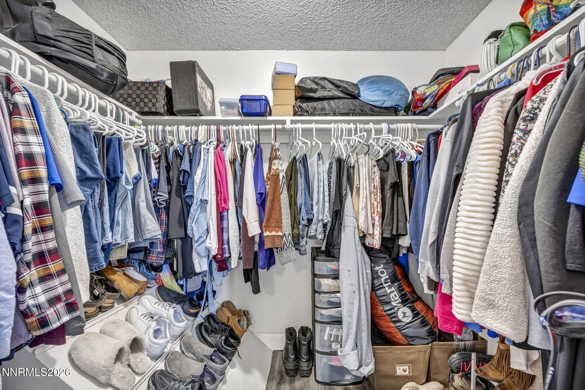 959 Mesa Ridge Drive, Unit 2 Sparks, NV 89434 - Photo 26 of 41 a view of walk in closet with clothes