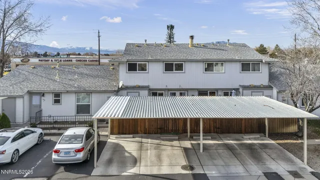 a front view of a house with parking space