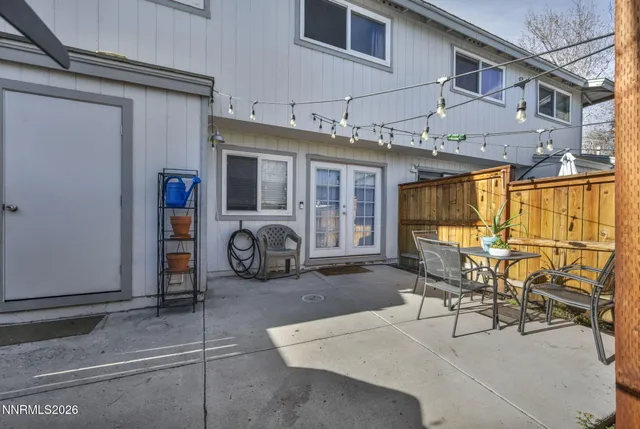 a view of a patio with table and chairs with wooden floor