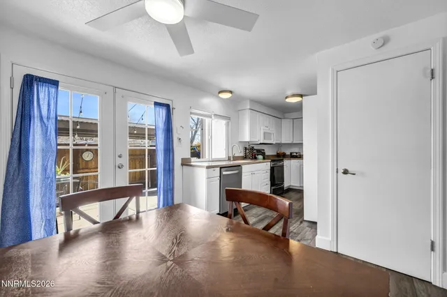 a view of kitchen with furniture and a refrigerator