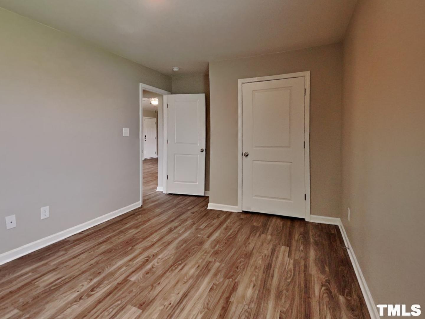 142 Beaver Tavern Drive Benson, NC 27504 - Photo 13 of 16 a view of an empty room and wooden floor