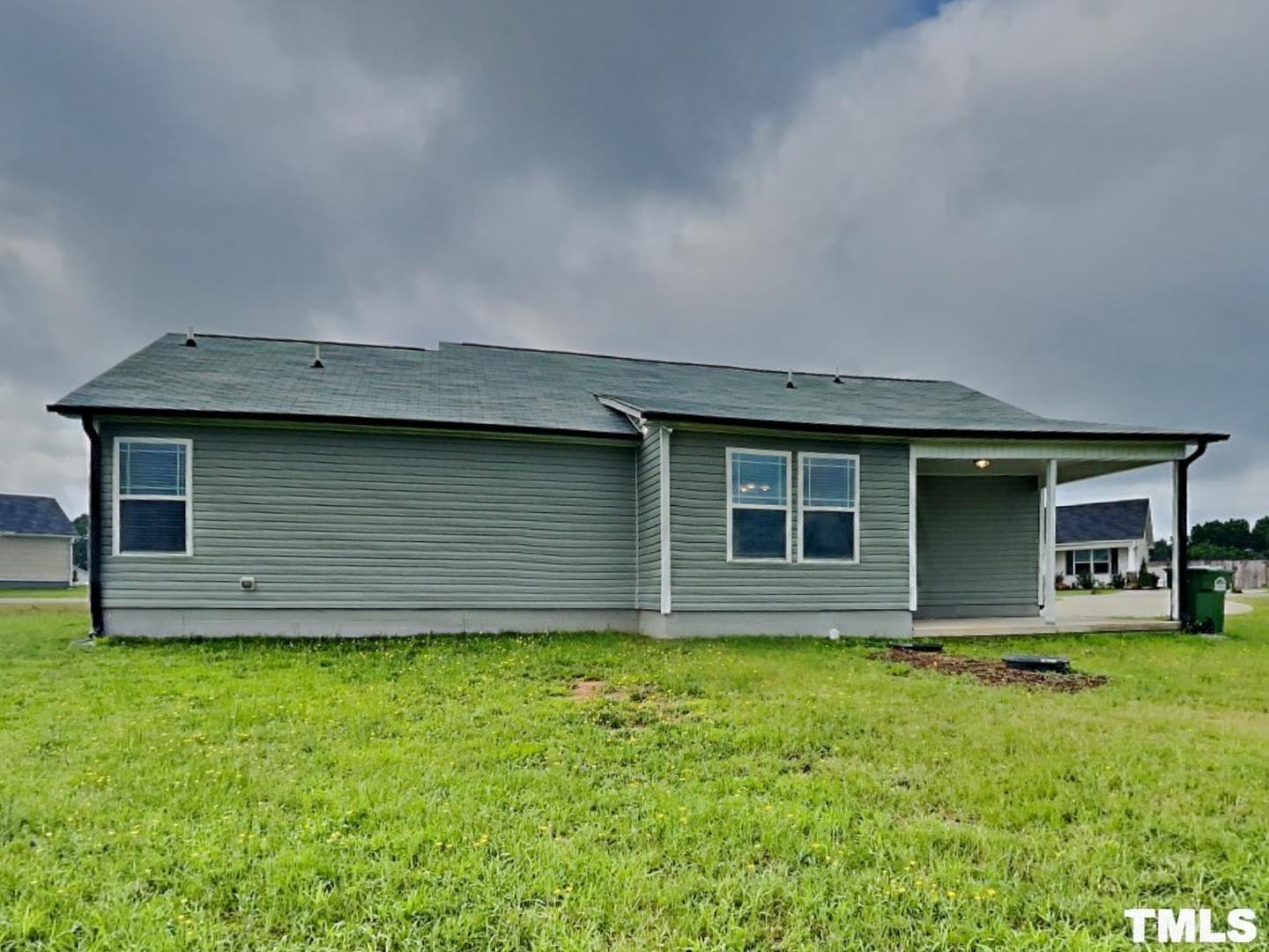 142 Beaver Tavern Drive Benson, NC 27504 - Photo 16 of 16 a house view with a garden space