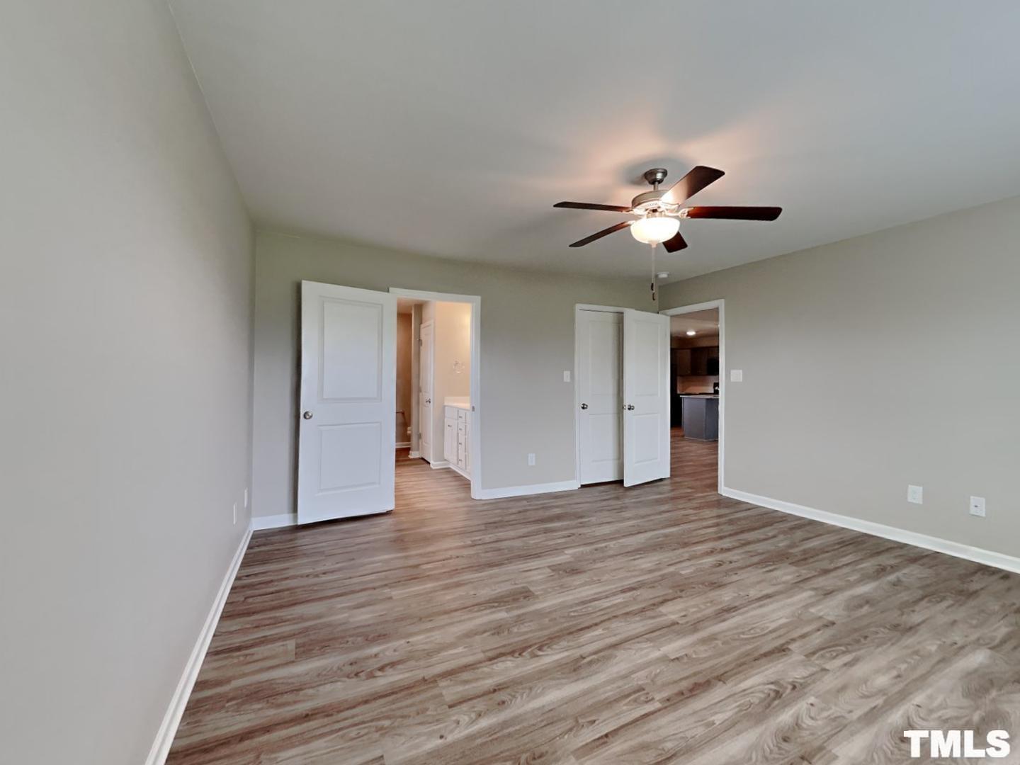 142 Beaver Tavern Drive Benson, NC 27504 - Photo 5 of 16 a view of an empty room with wooden floor