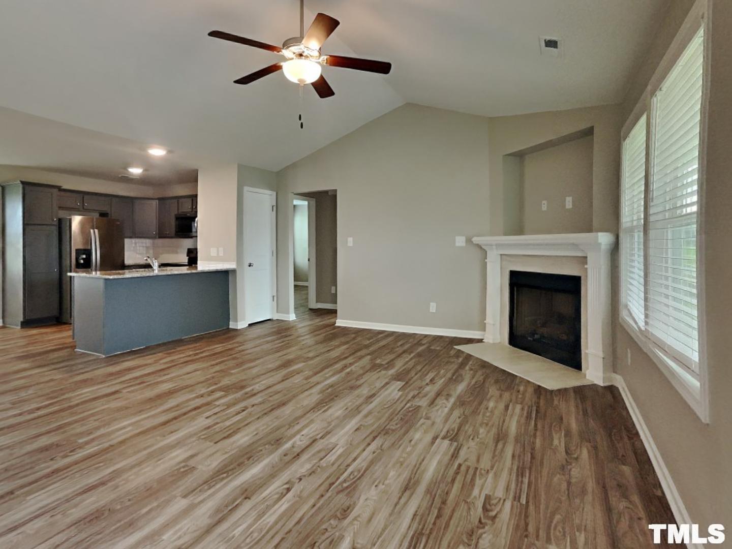 142 Beaver Tavern Drive Benson, NC 27504 - Photo 7 of 16 a view of a kitchen with a sink and a kitchen counter top space