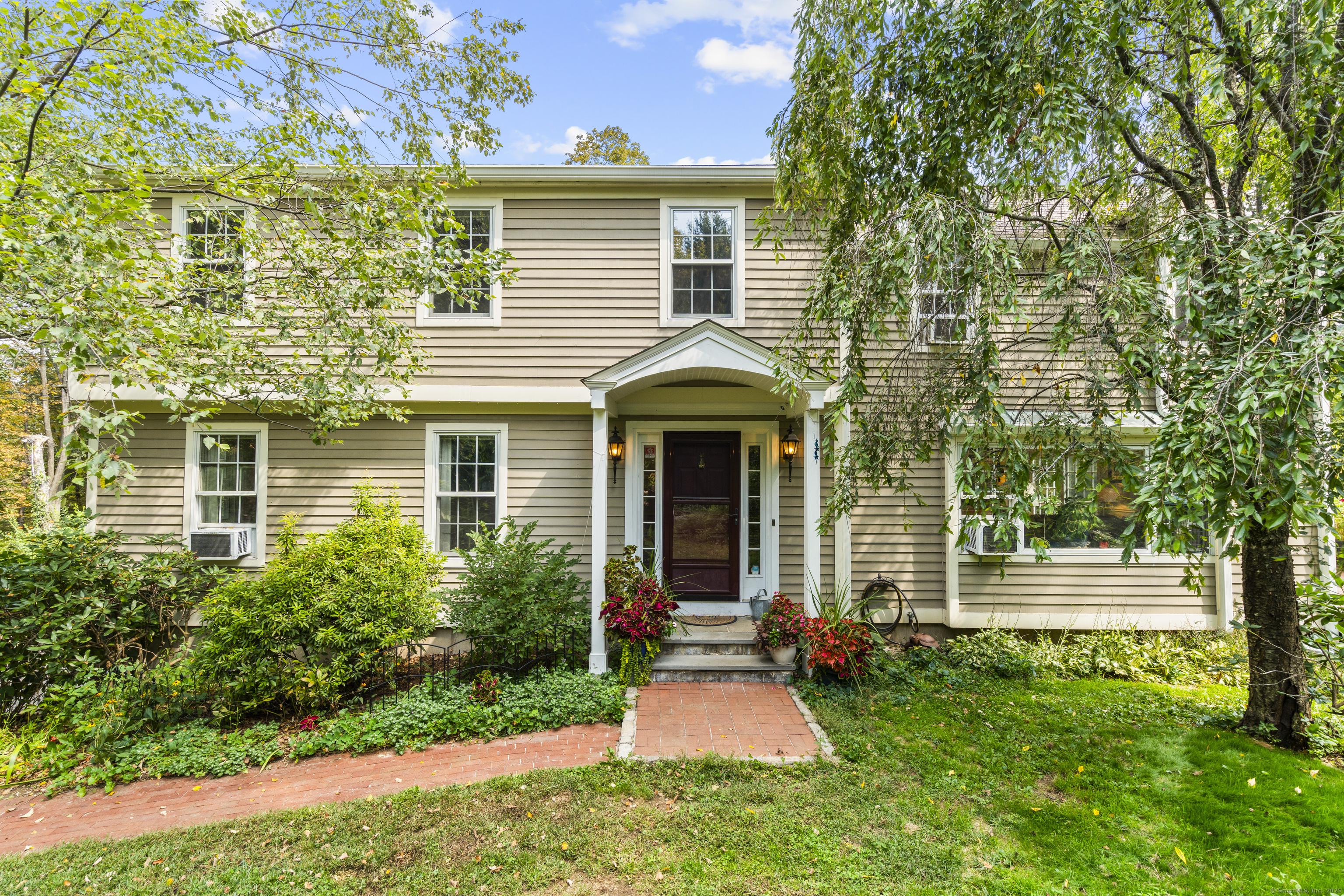 front view of a house with a yard