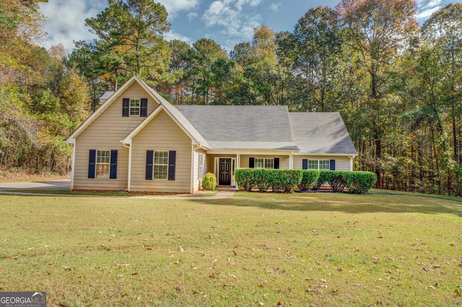 1368 Halls Bridge Road Jackson, GA 30233 - Photo 1 of 1 a front view of house with yard and green space