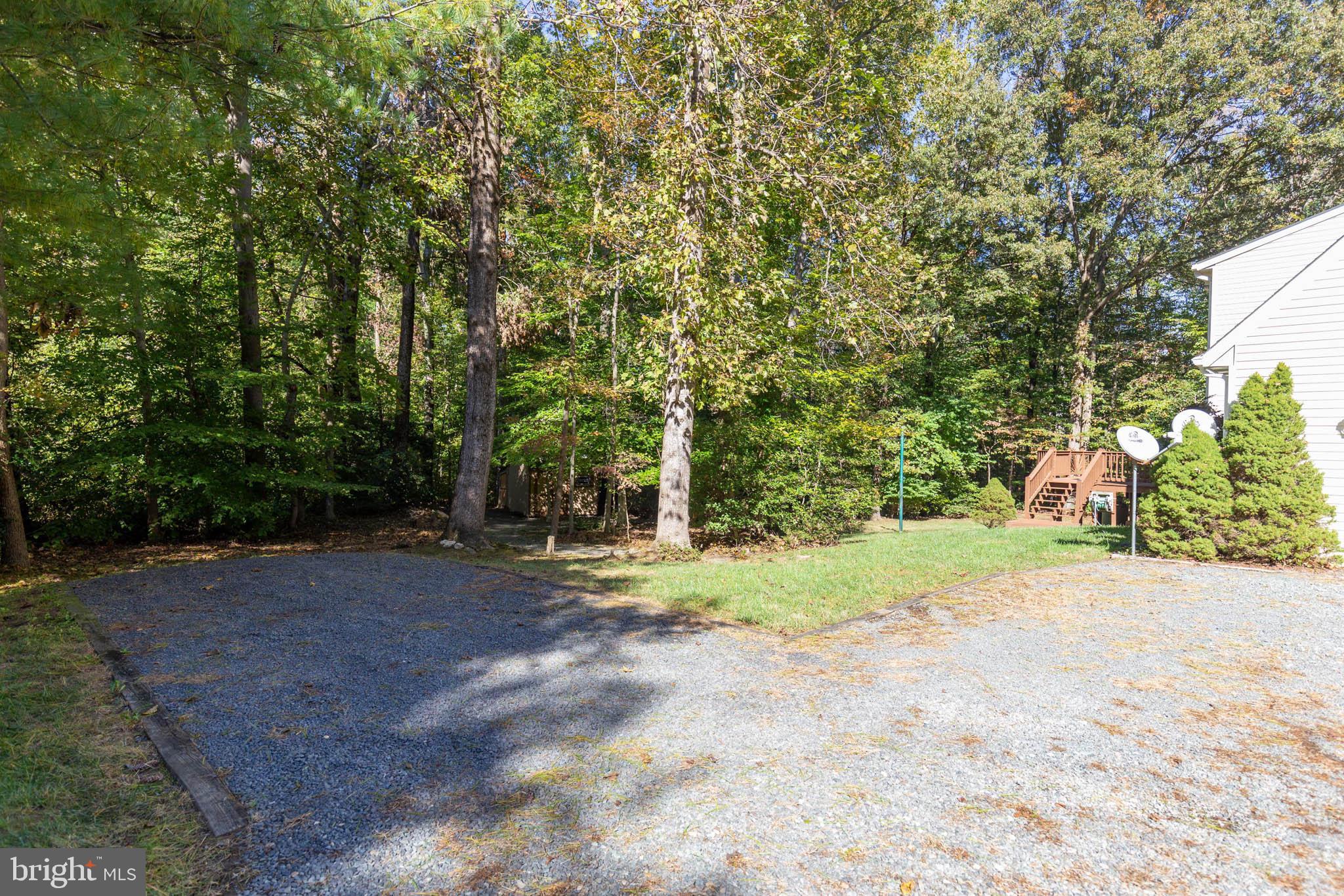 640 Small Reward Road Huntingtown, MD 20639 - Photo 27 of 28 a view of a yard with large trees