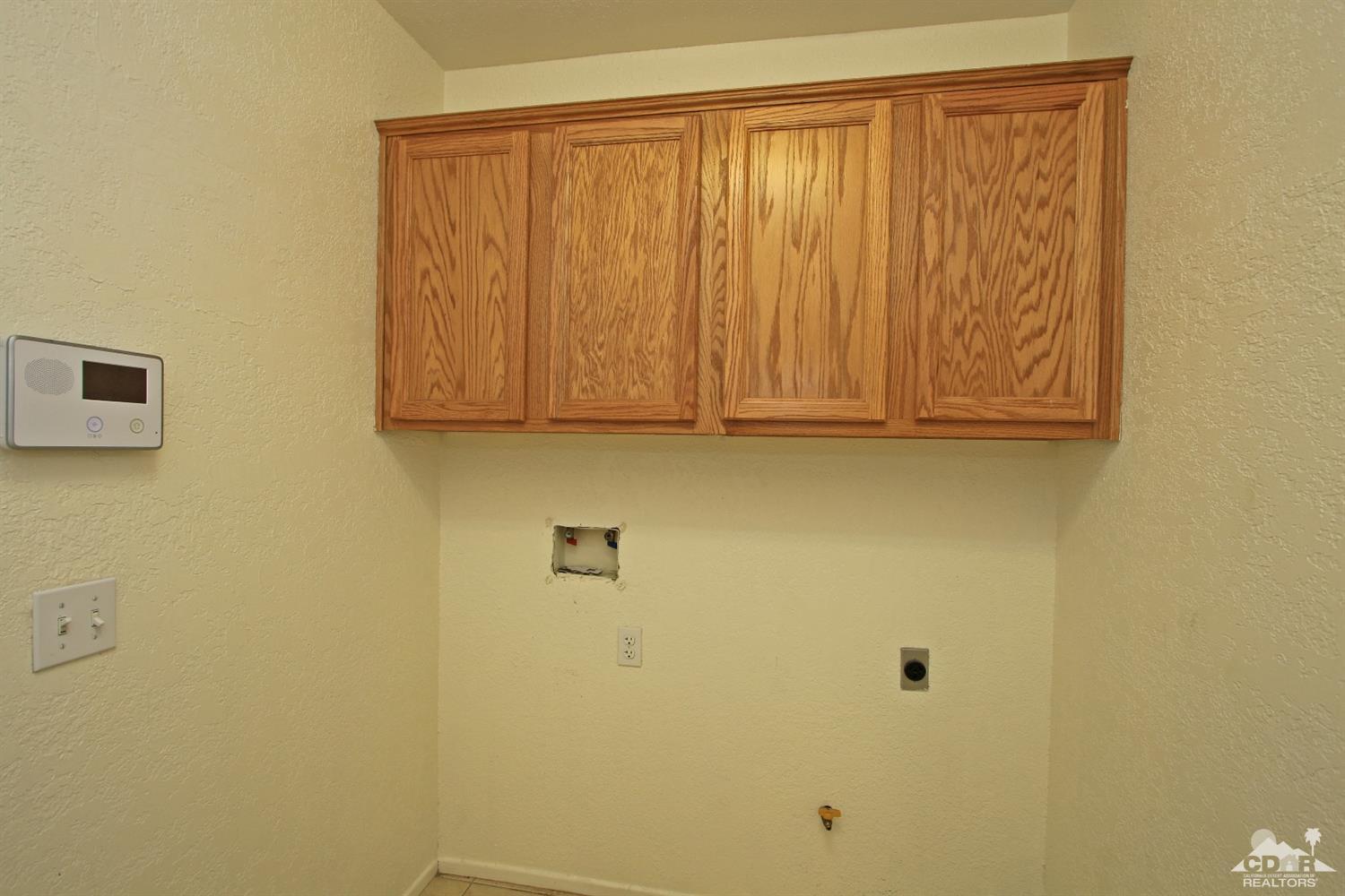 13810 United Road Desert Hot Springs, CA 92240 - Photo 13 of 41 a bathroom with a shower curtain