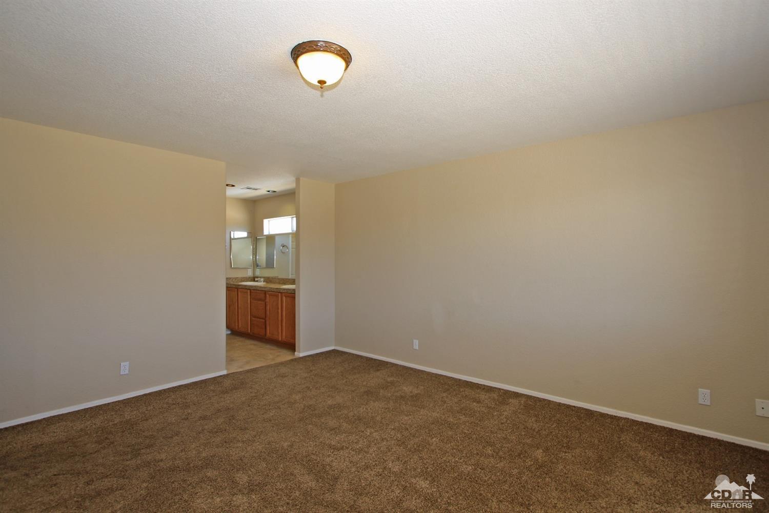 13810 United Road Desert Hot Springs, CA 92240 - Photo 16 of 41 an empty room with windows