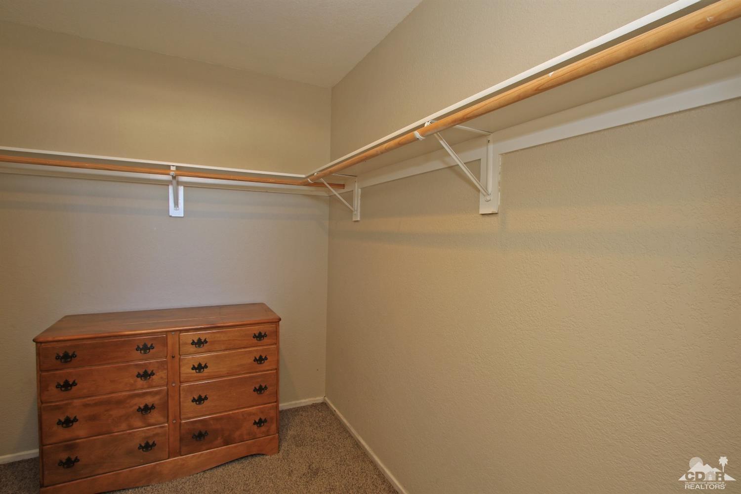 13810 United Road Desert Hot Springs, CA 92240 - Photo 20 of 41 a view of room with racks on the wall