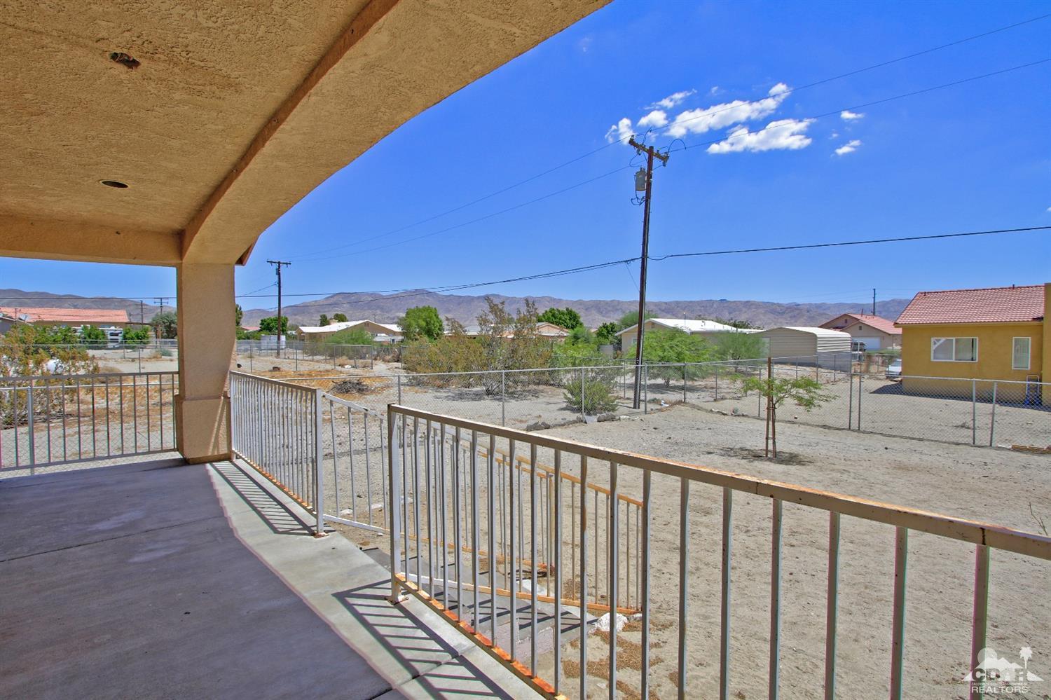 13810 United Road Desert Hot Springs, CA 92240 - Photo 28 of 41 a view of a balcony with couches