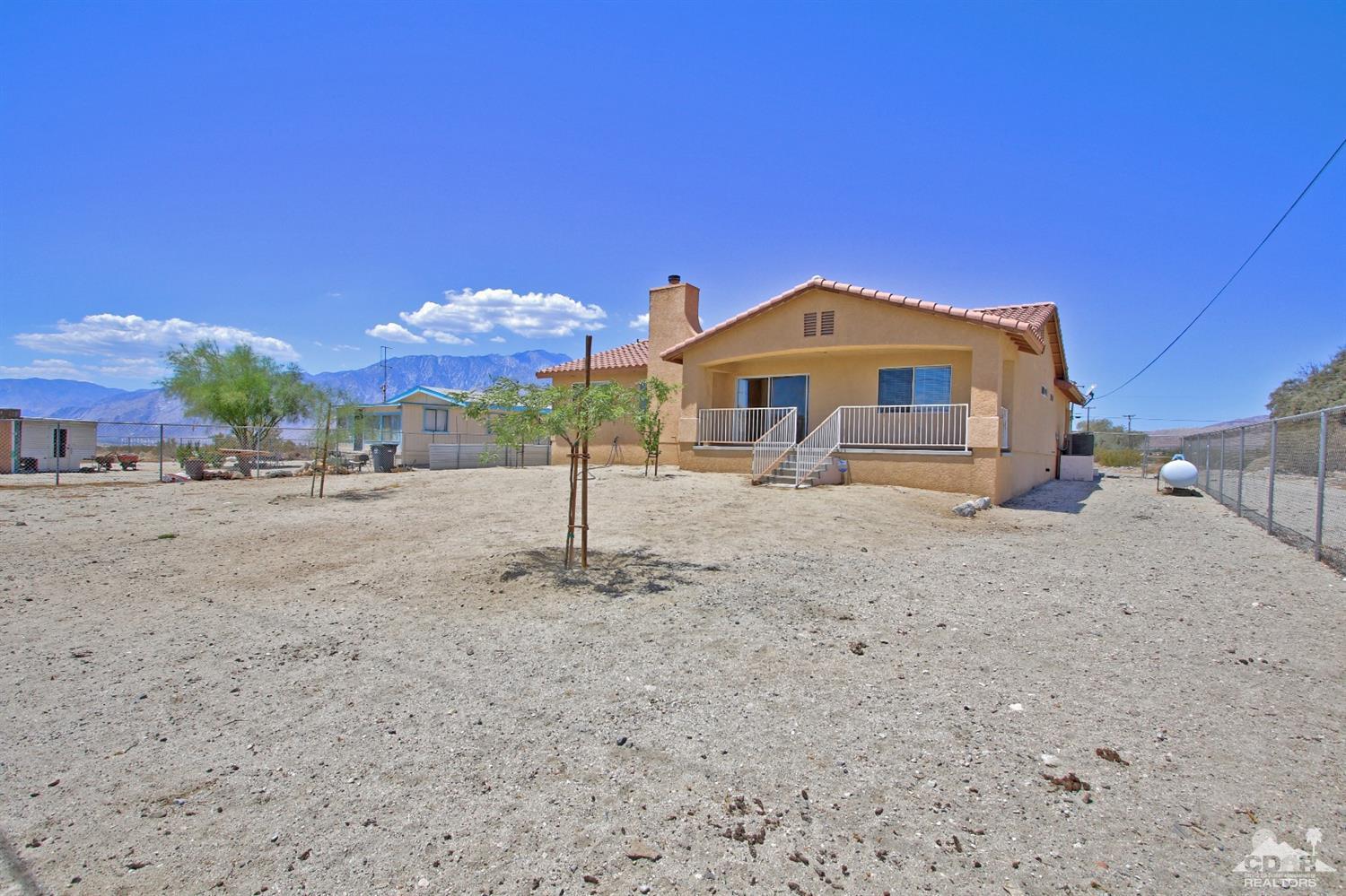 13810 United Road Desert Hot Springs, CA 92240 - Photo 32 of 41 a front view of a house with a yard